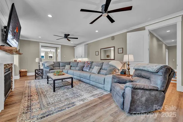 a room with wooden floor and cabinets