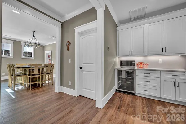 a bedroom with bed and a mirror