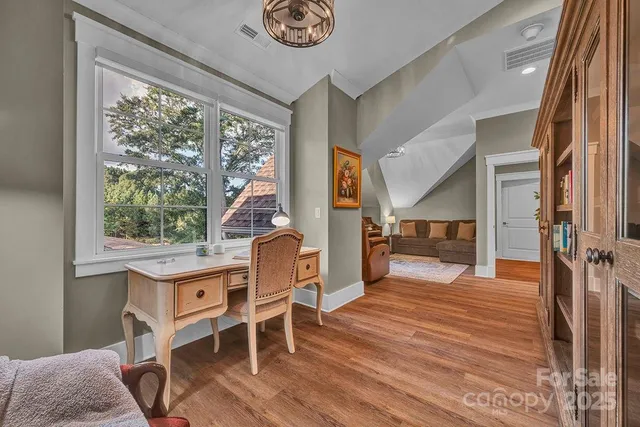 a bedroom with bed and a mirror