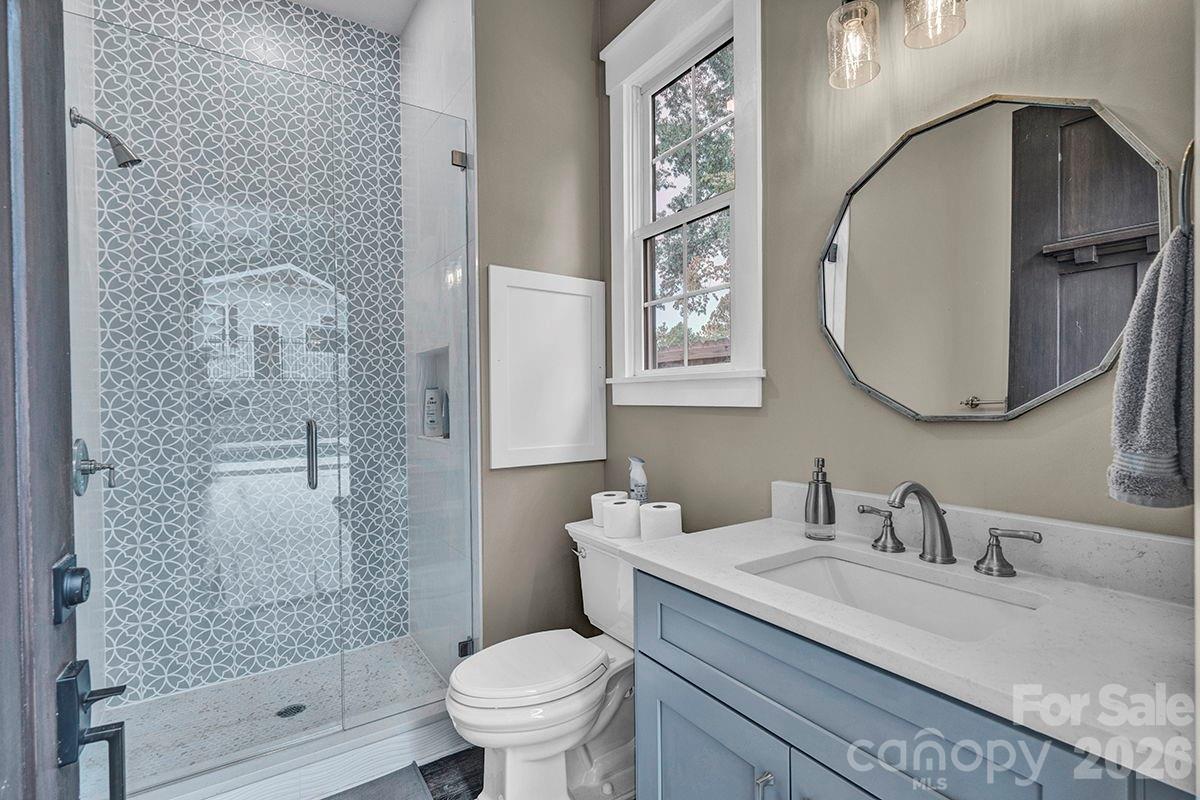 1619 Ellis Belk Road Monroe, NC 28112 - Photo 31 of 47 a bathroom with a granite countertop sink a toilet and shower