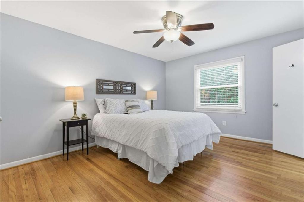 1010 Scott Boulevard, Unit B1 Decatur, GA 30030 - Photo 11 of 20 a bedroom with a bed and a chandelier