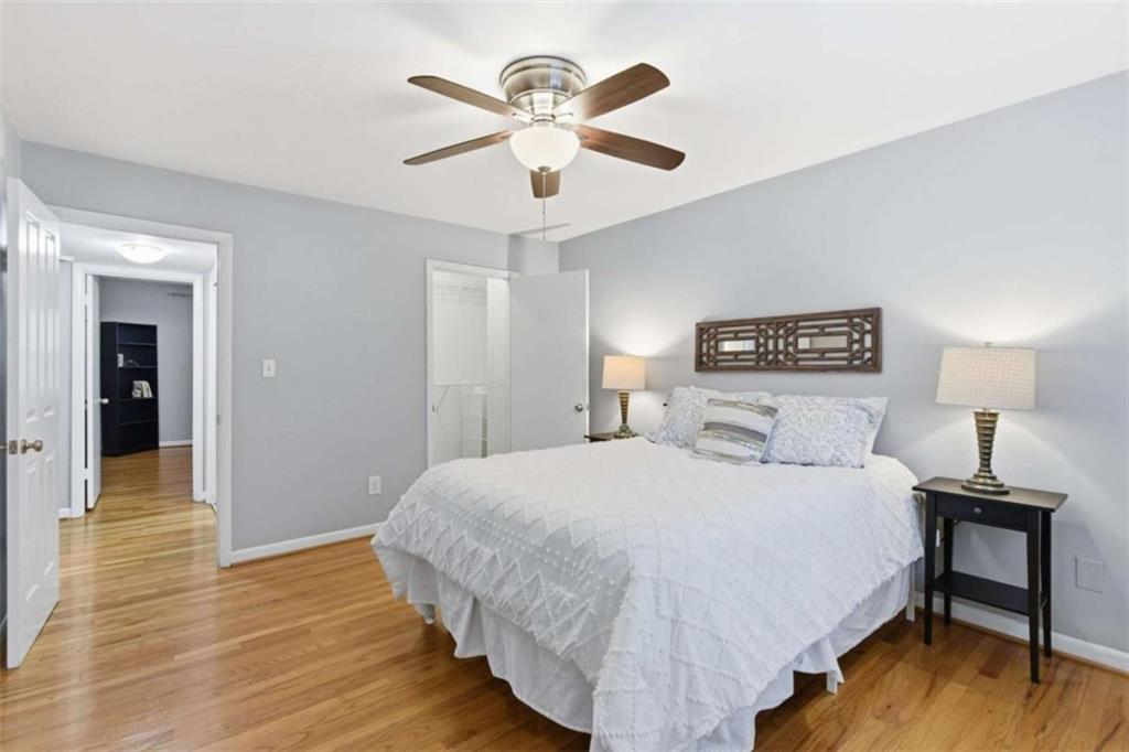 1010 Scott Boulevard, Unit B1 Decatur, GA 30030 - Photo 12 of 20 a bedroom with a bed and a chandelier