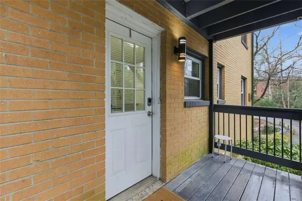 a view of a brick house with wooden floor