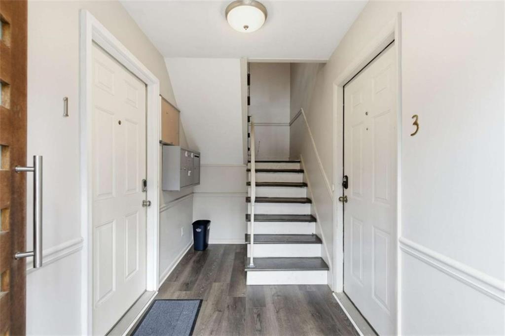 1010 Scott Boulevard, Unit B1 Decatur, GA 30030 - Photo 14 of 20 a view of a hallway with wooden floor and entryway