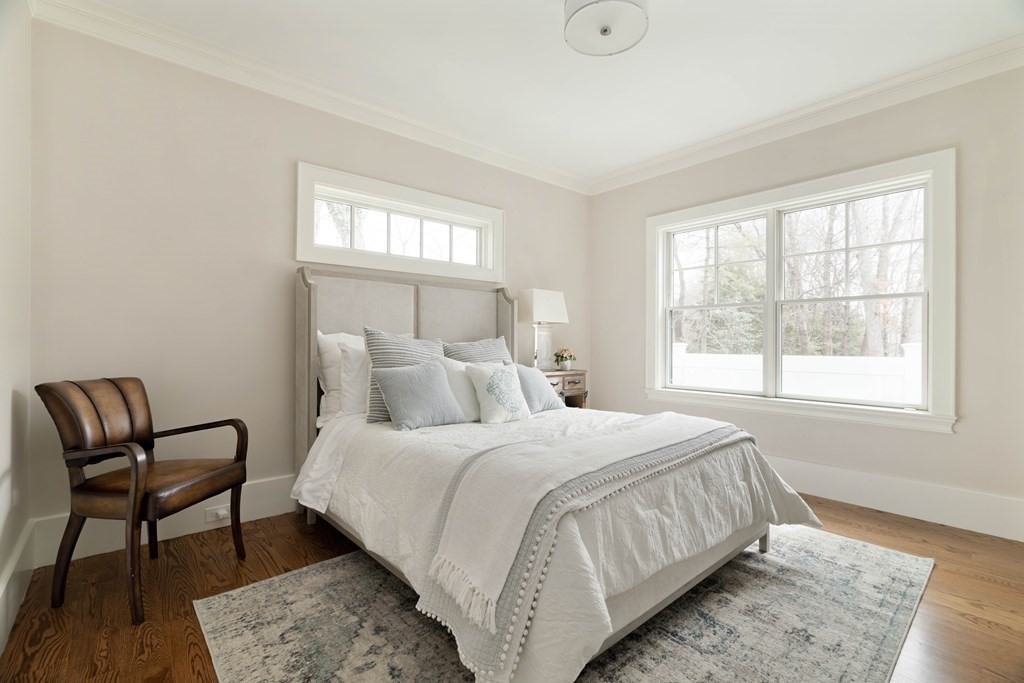 700 Chestnut Street Needham, MA 02492 - Photo 17 of 41 a bedroom with a bed chair and window