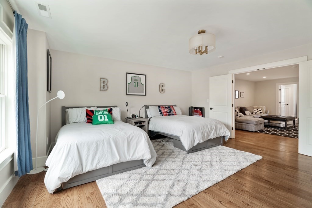 700 Chestnut Street Needham, MA 02492 - Photo 18 of 41 a bedroom with two beds and painting on the wall