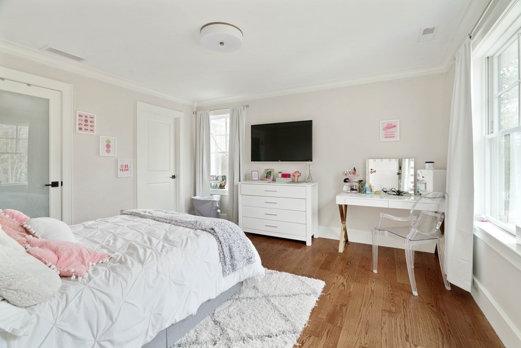 700 Chestnut Street Needham, MA 02492 - Photo 20 of 41 a bedroom with a bed and a flat screen tv