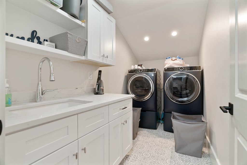 700 Chestnut Street Needham, MA 02492 - Photo 31 of 41 a utility room with sink dryer and washer