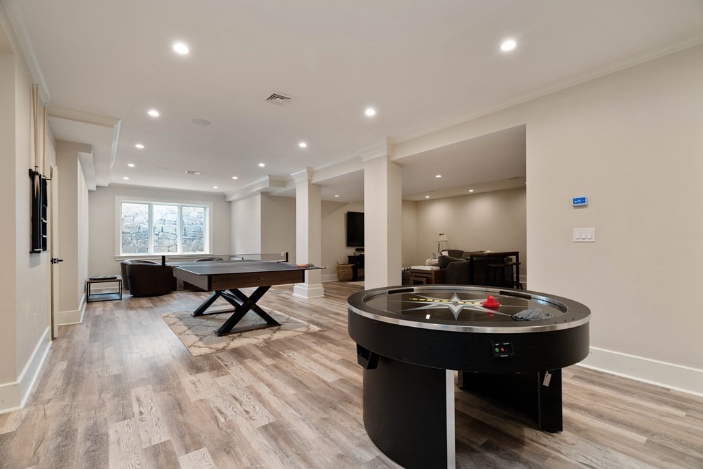 700 Chestnut Street Needham, MA 02492 - Photo 33 of 41 a living room with furniture and a wooden floor