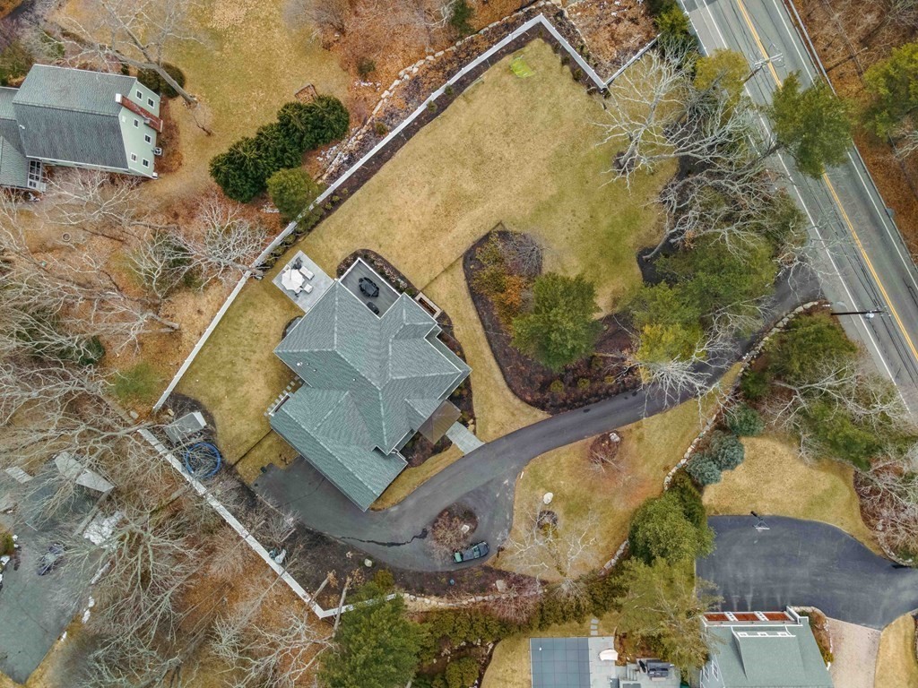 700 Chestnut Street Needham, MA 02492 - Photo 4 of 41 an aerial view of a house with a yard and swimming pool