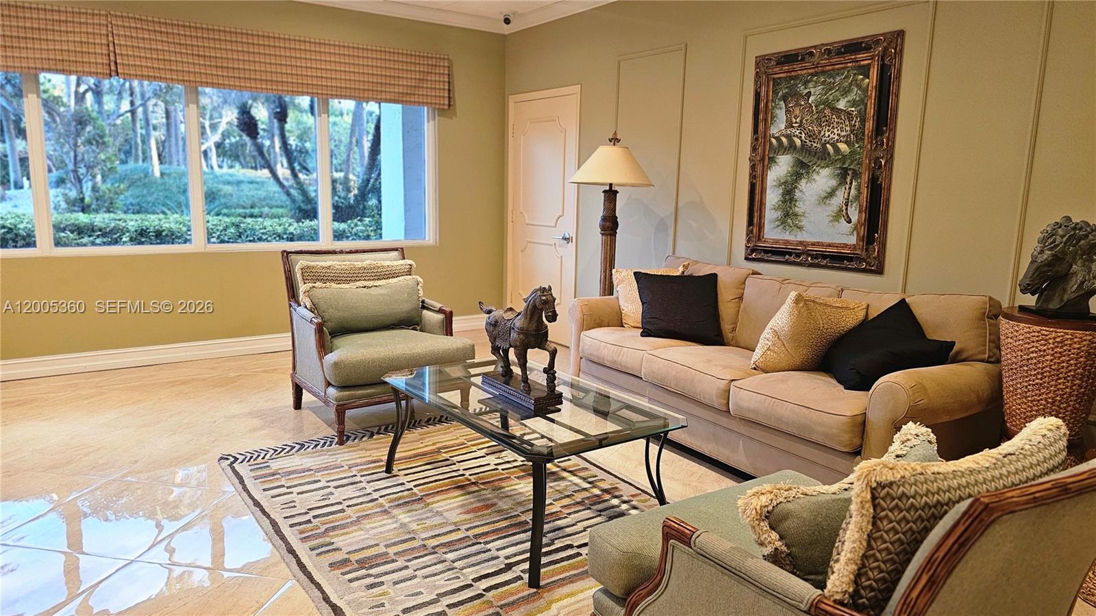 4001 North Ocean Boulevard, Unit 702 Boca Raton, FL 33431 - Photo 44 of 56 a living room with furniture and a large window