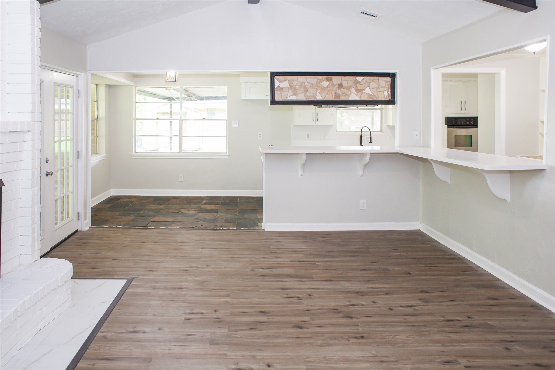 912 Robinson Road La Porte, TX 77571 - Photo 23 of 39 a view of kitchen with wooden floor and electronic appliances