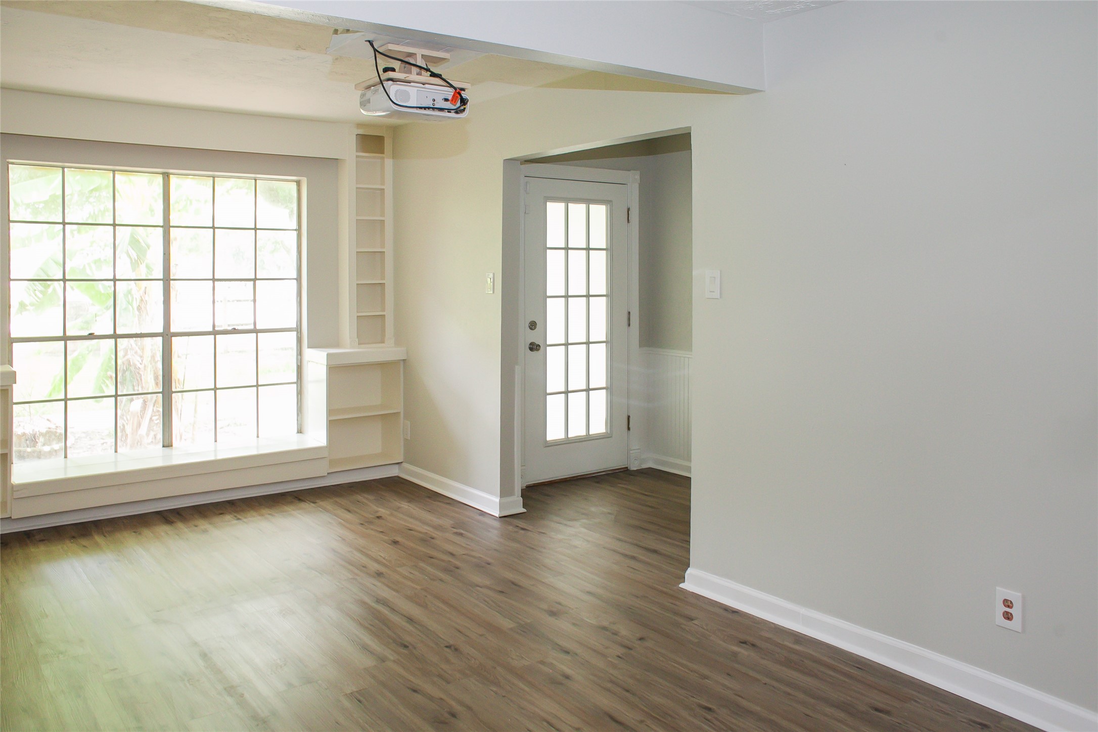 912 Robinson Road La Porte, TX 77571 - Photo 26 of 39 an empty room with wooden floor and windows