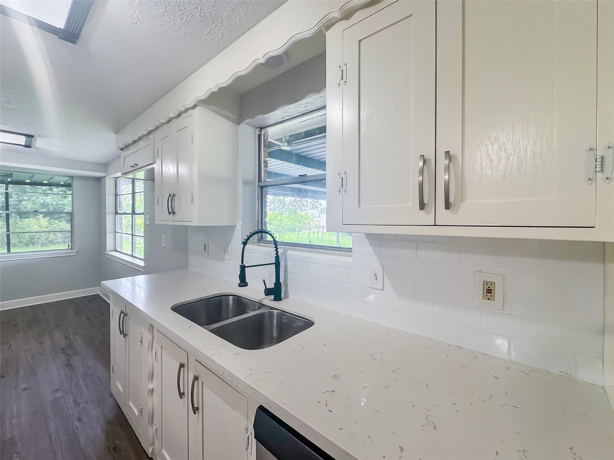 912 Robinson Road La Porte, TX 77571 - Photo 10 of 39 a kitchen with a sink and cabinets
