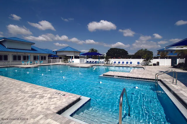 a view of a house with swimming pool
