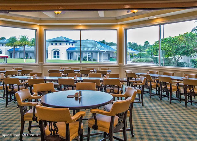 a outdoor dining space with furniture and outdoor view
