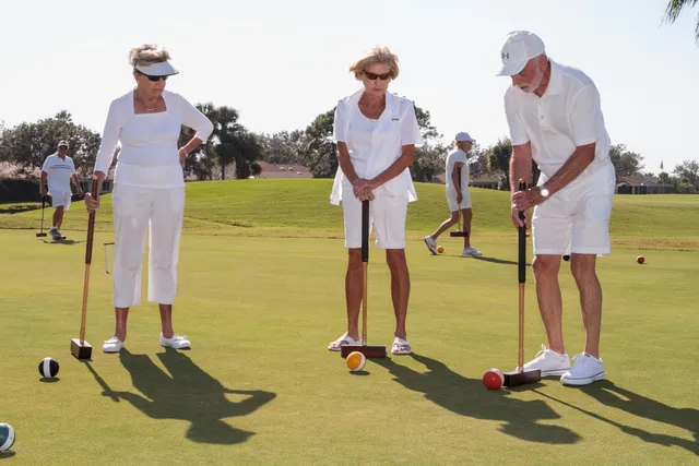 a room with gym equipment and large mirror