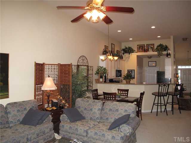 10472 Dapping Drive Raleigh, NC 27614 - Photo 5 of 12 a living room with furniture and a chandelier