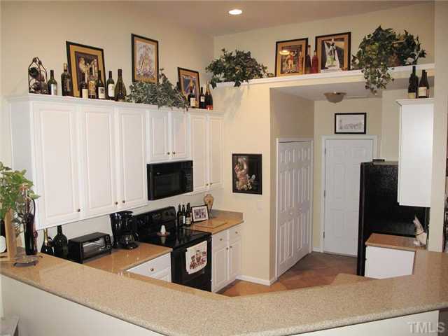 10472 Dapping Drive Raleigh, NC 27614 - Photo 6 of 12 a living room with furniture and a flat screen tv