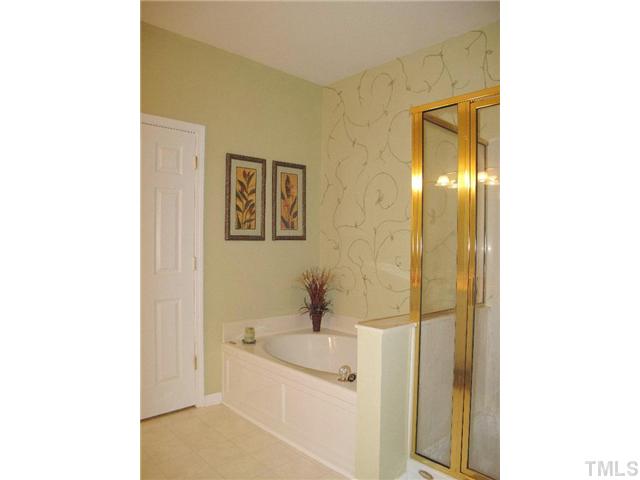 10472 Dapping Drive Raleigh, NC 27614 - Photo 8 of 12 a bathroom with a sink and a mirror