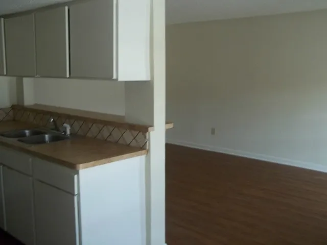a kitchen with a sink and cabinets