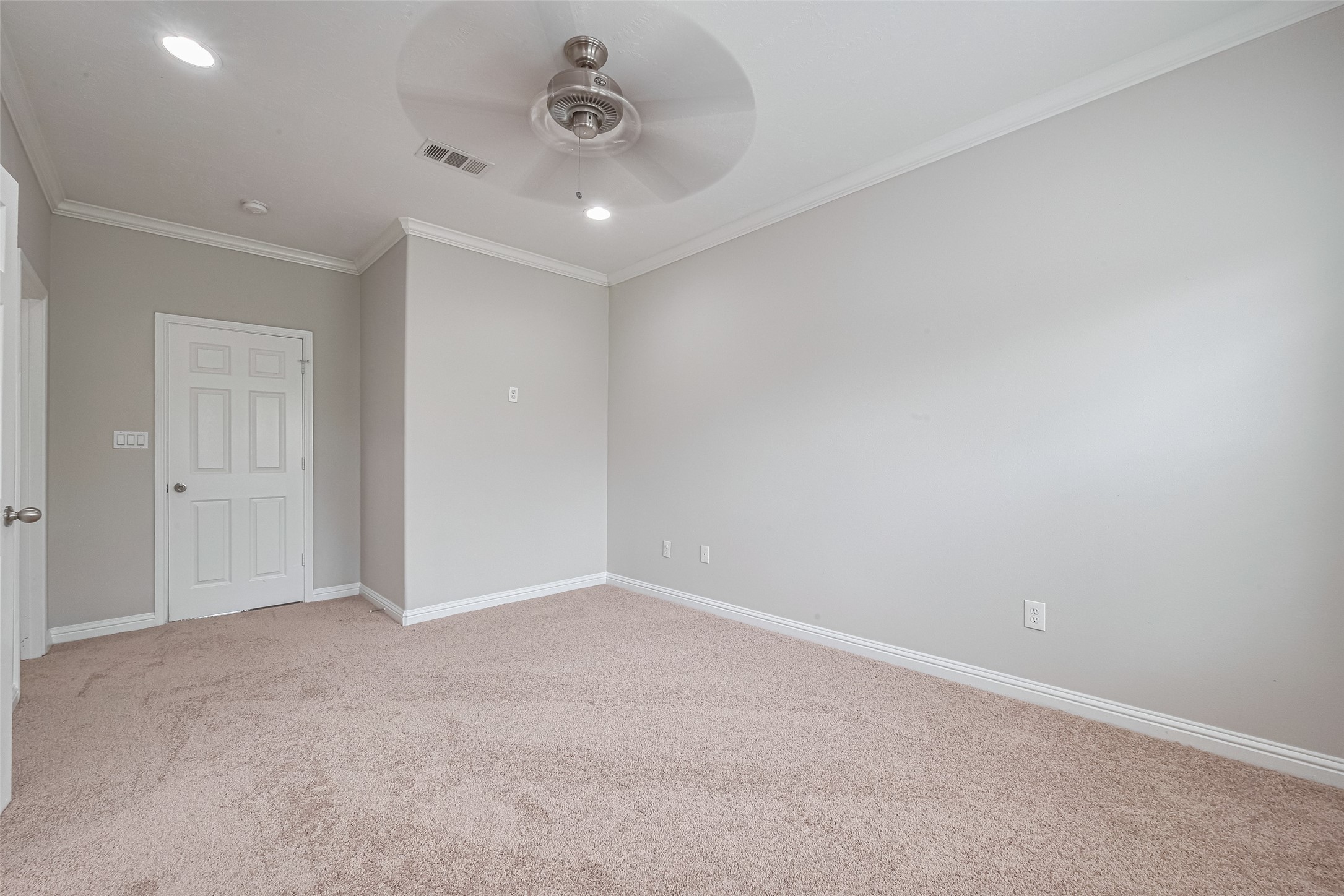 15210 Addicks Stone Drive, Unit B Houston, TX 77082 - Photo 18 of 31 an empty room with a empty space and a ceiling fan