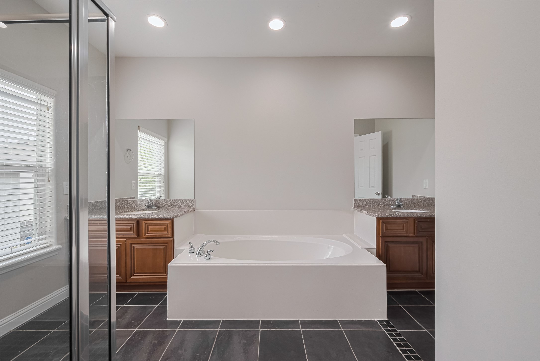 15210 Addicks Stone Drive, Unit B Houston, TX 77082 - Photo 20 of 31 a bathroom with a bathtub and a sink