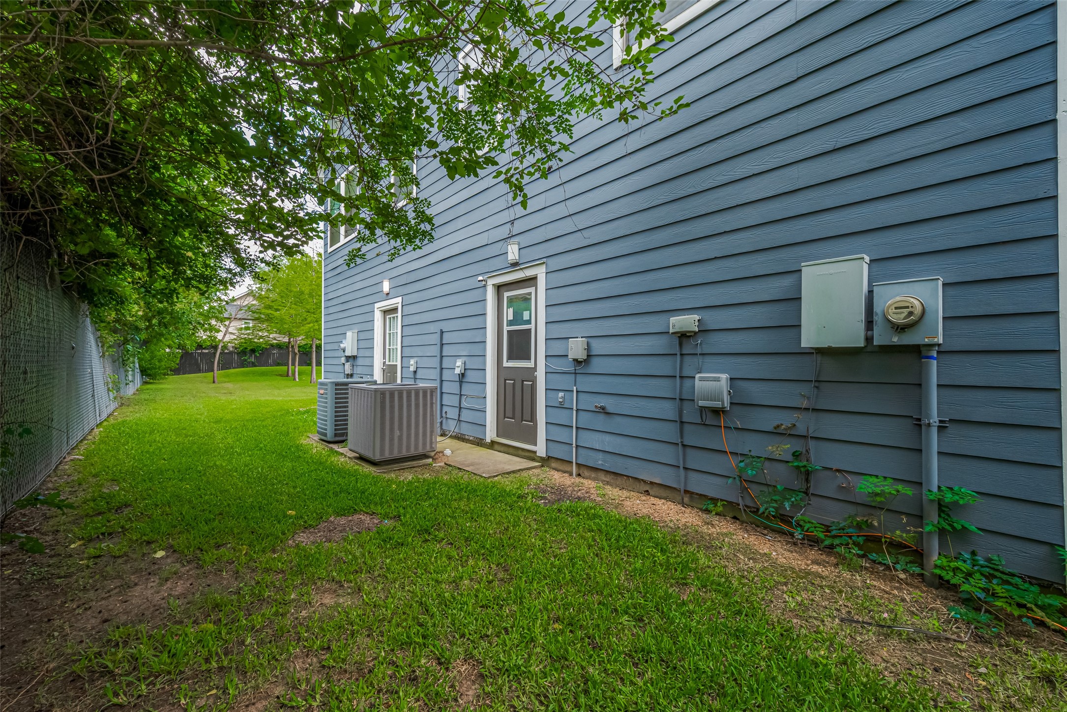15210 Addicks Stone Drive, Unit B Houston, TX 77082 - Photo 30 of 31 a view of a house with a backyard