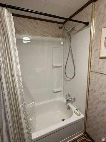 1085 West Elk Road Helper, UT 84526 - Photo 6 of 40 White tub and shower combination unit featuring an integrated soap dish and shelving