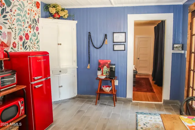 a view of an entryway with wooden floor