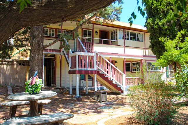 a view of a chairs and table in patio