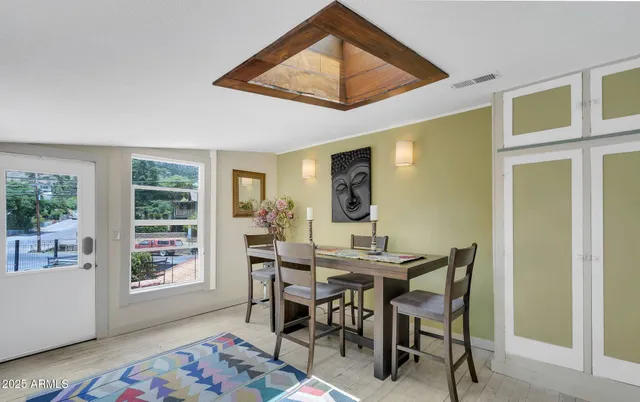 a view of a livingroom with furniture and a window