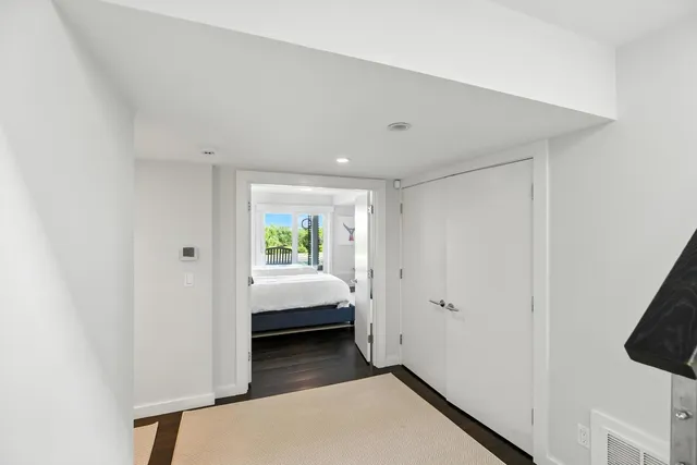 a bedroom with two beds and a large window