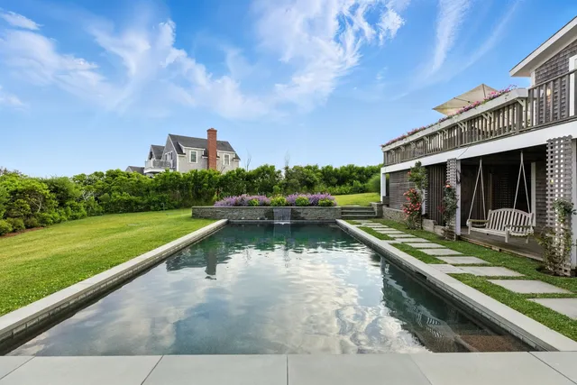 a view of an swimming pool and a yard