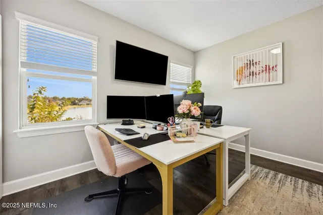 a view of a workspace with furniture