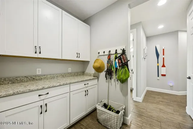 a utility room with cabinets