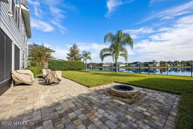 a view of swimming pool with outdoor seating and plants