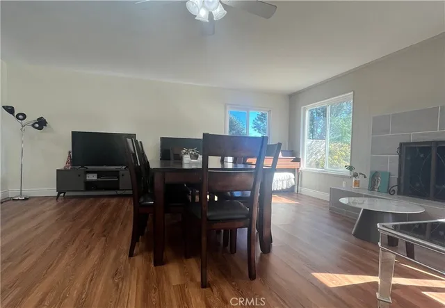 a view of a dining room with furniture window and wooden floor
