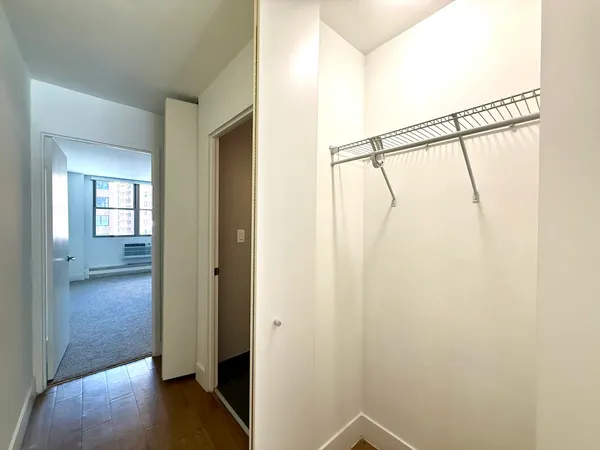 a view of an entryway with wooden floor