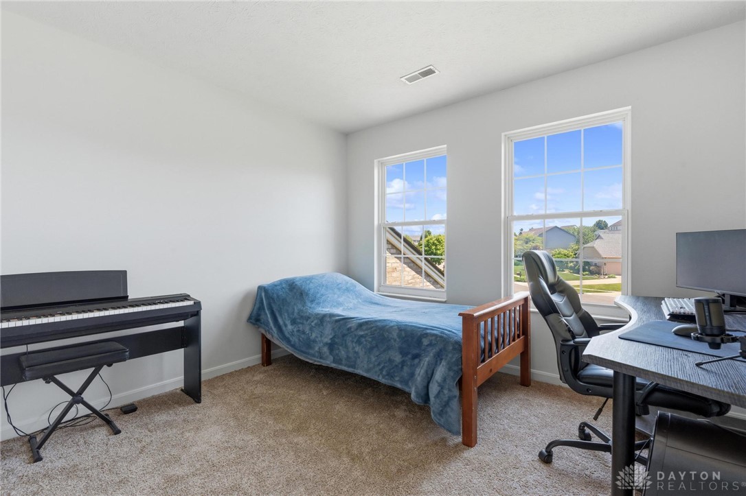 70 Martin Lane Springboro, OH 45066 - Photo 29 of 69 This bright room features abundant natural light and soft carpeting, creating a comfortable and inviting atmosphere.