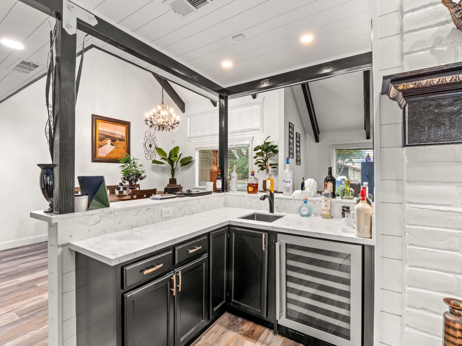 1691 South Bailey Avenue Fresno, CA 93727 - Photo 22 of 41 a kitchen with a sink and a refrigerator