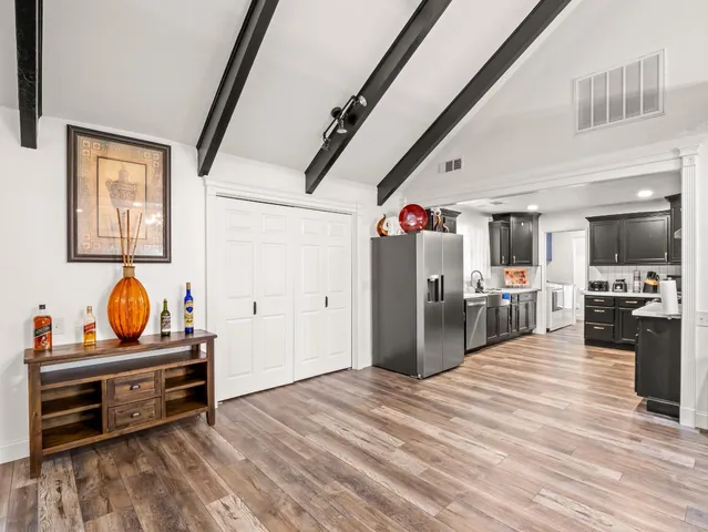 a large kitchen with stainless steel appliances
