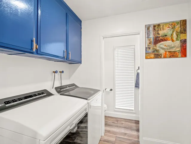 a bathroom with a granite countertop sink mirror and vanity