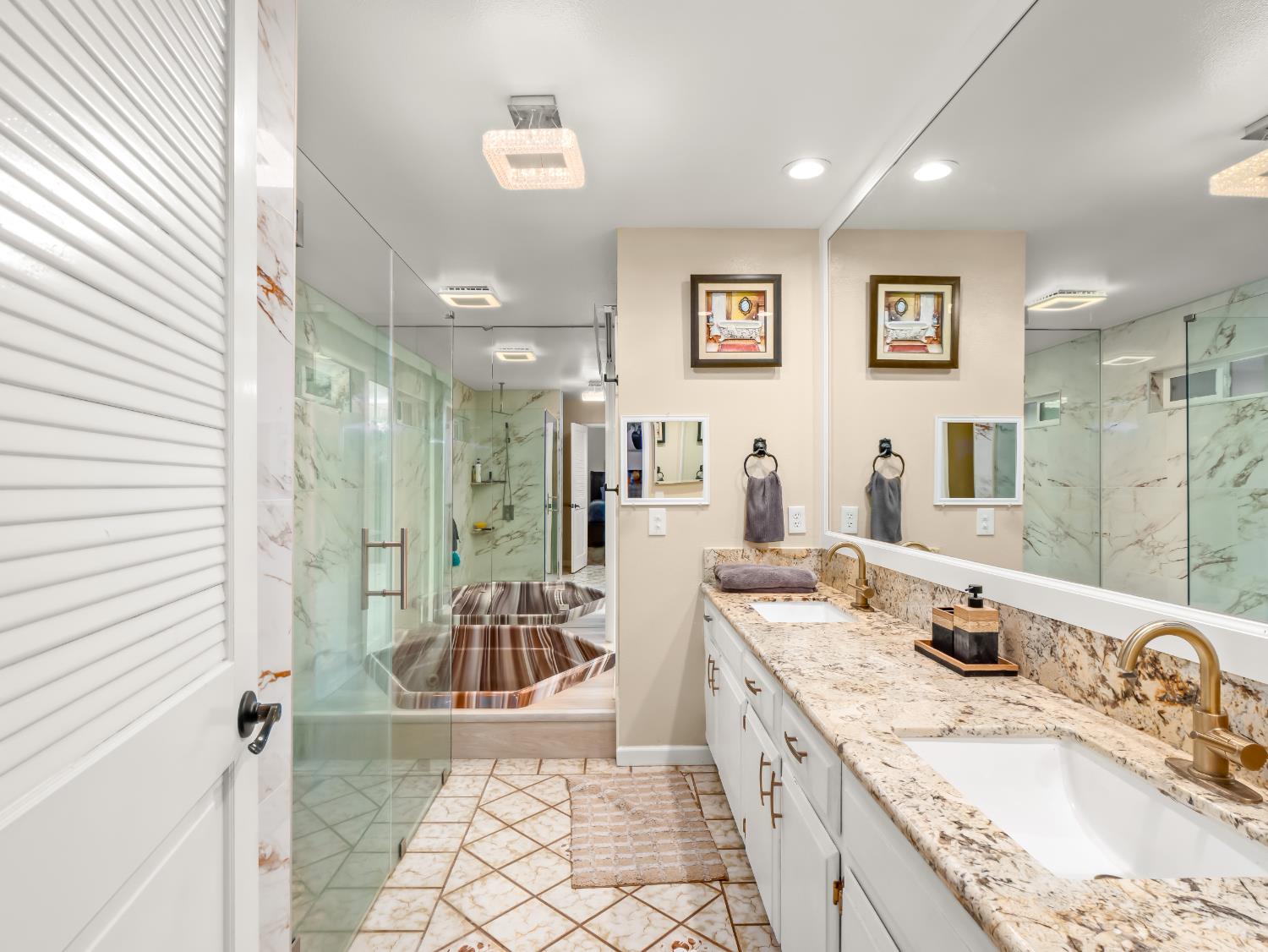 1691 South Bailey Avenue Fresno, CA 93727 - Photo 36 of 41 a bathroom with a granite countertop sink mirror and shower