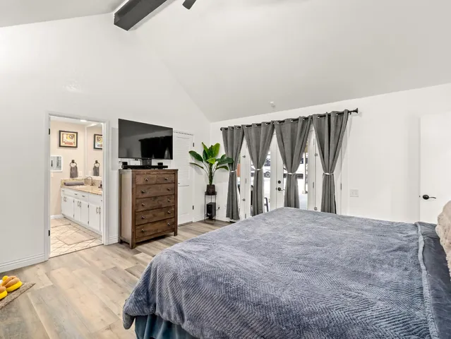 a bathroom with a sink a mirror and shower