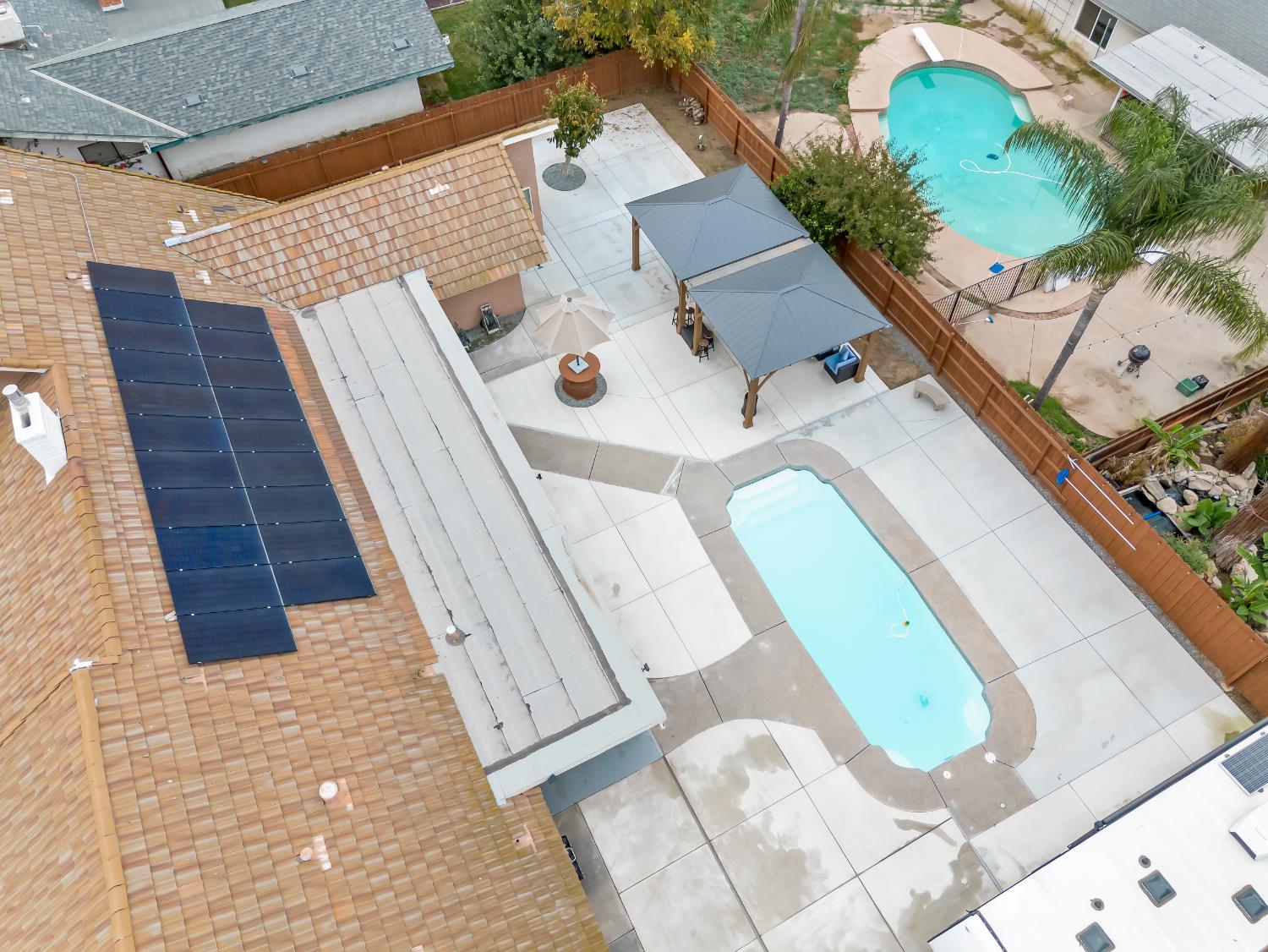 1691 South Bailey Avenue Fresno, CA 93727 - Photo 6 of 41 an aerial view of a house with a swimming pool