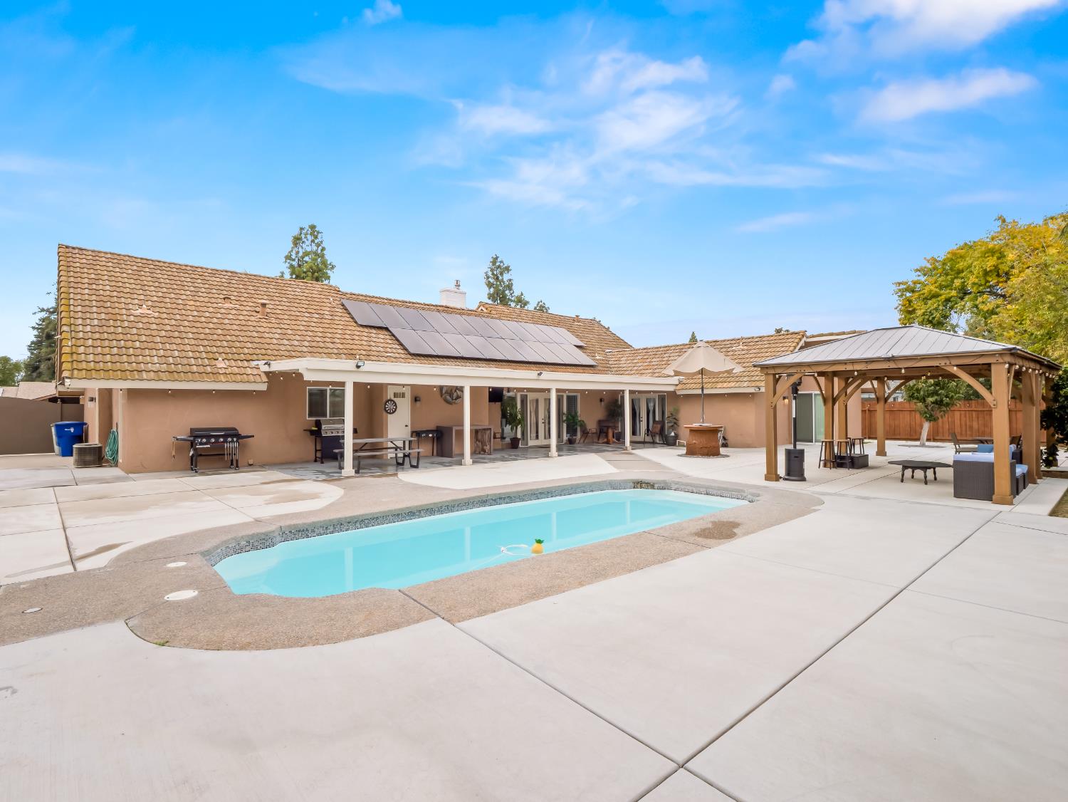 1691 South Bailey Avenue Fresno, CA 93727 - Photo 7 of 41 a front view of a house with a yard