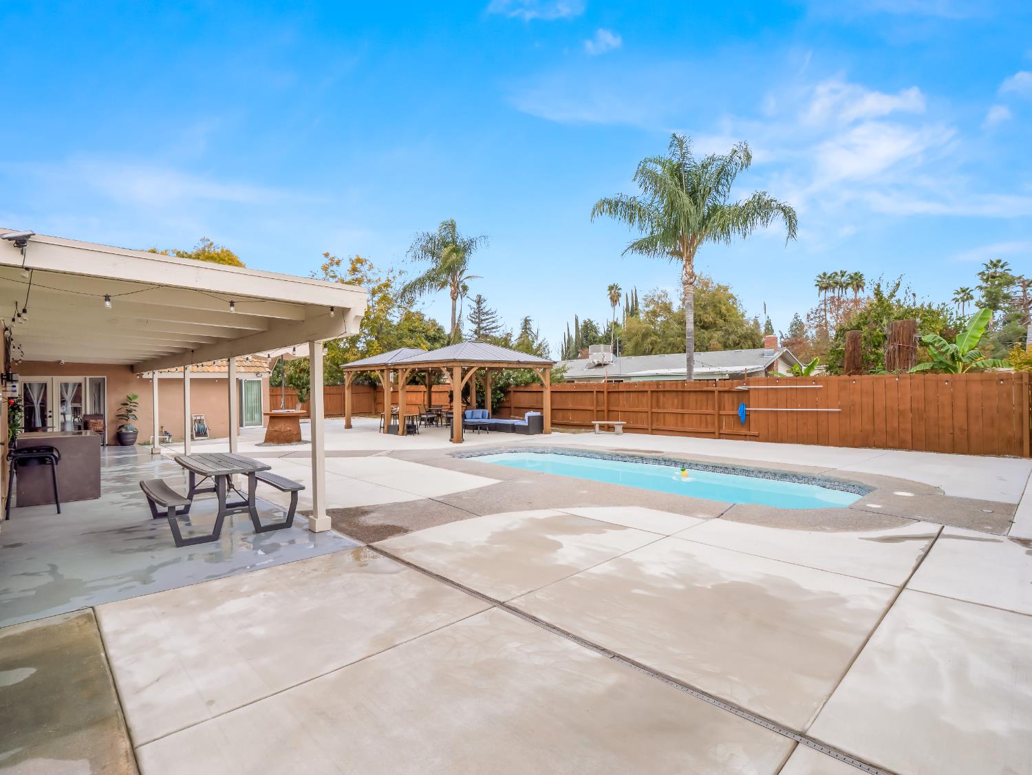 1691 South Bailey Avenue Fresno, CA 93727 - Photo 8 of 41 a view of a swimming pool with outdoor seating