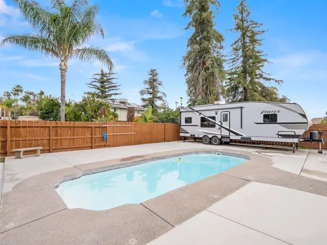 a house view with a backyard space