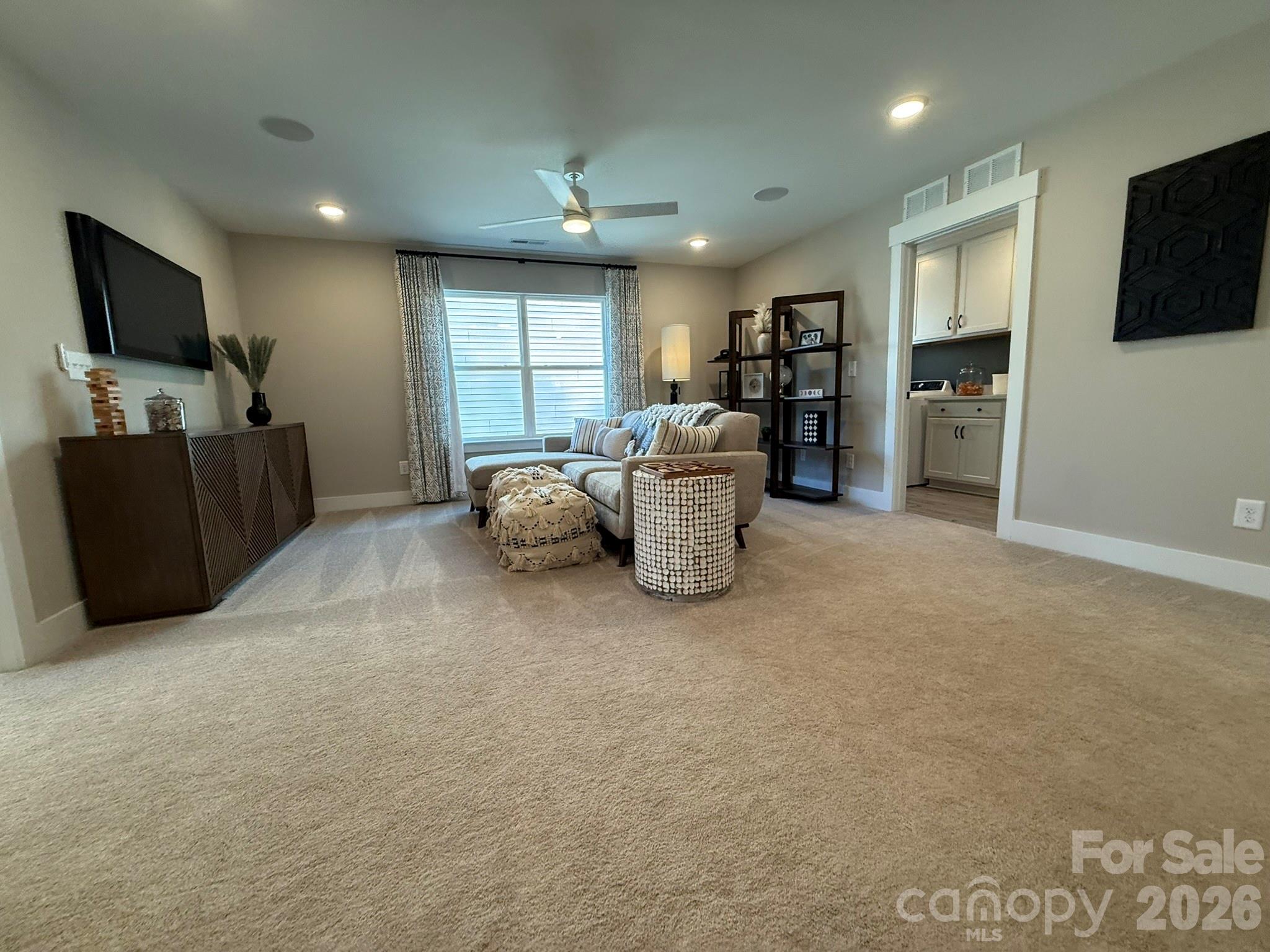 5104 Verona Road Charlotte, NC 28213 - Photo 12 of 28 a living room with furniture and a flat screen tv